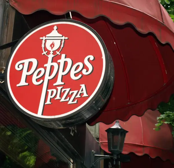 Peppez Pizza Logo Pozadí Zblízka — Stock fotografie