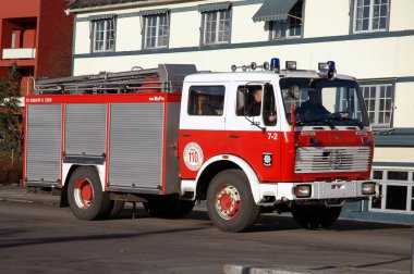 Firetruck on city street in daytime