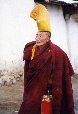 Tibetan monk, travel place on background