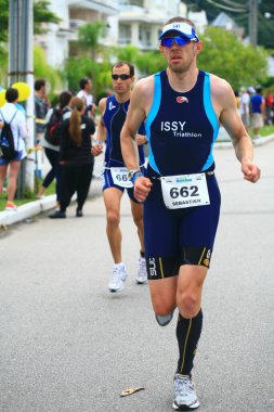 FLORIANOPOLIS - SANTA CATARINA, BRAZIL, 31 Mayıs 2009 'da Florianopolis - Santa Catarina - Brezilya' da düzenlenen Ironman triatlon yarışında kimliği belirsiz yarışçılar yarıştı.