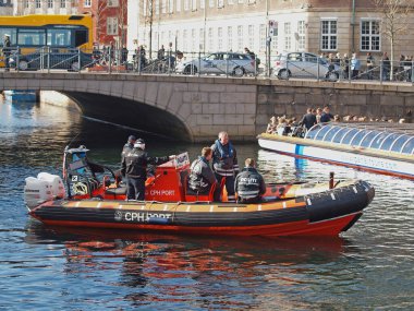 Danish policemen on boat, daytime view 