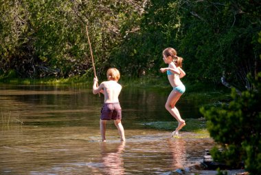 Children having fun in lake