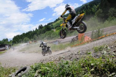 Male Racers at Supermoto race, daytime view 