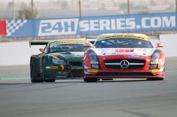 racing speed cars at 24 Hour Race at Dubai Autodrome on January 14, 2012