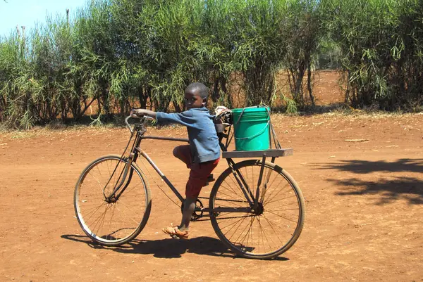 African Child Bicycle Looking Camera — Zdjęcie stockowe
