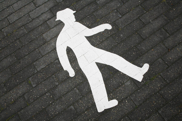 walking sign of a man on a road in the city
