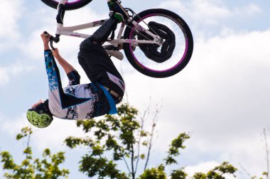 bmx rider performing a stunt on a ramp clipart