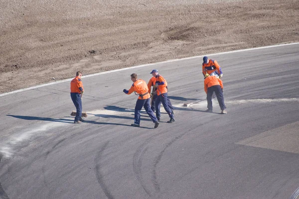 Race Officials Cleaning Track — Stock Photo, Image