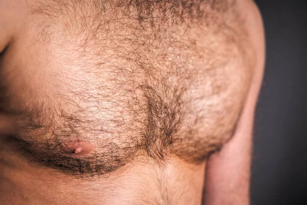 hairy chest of the handsome young man