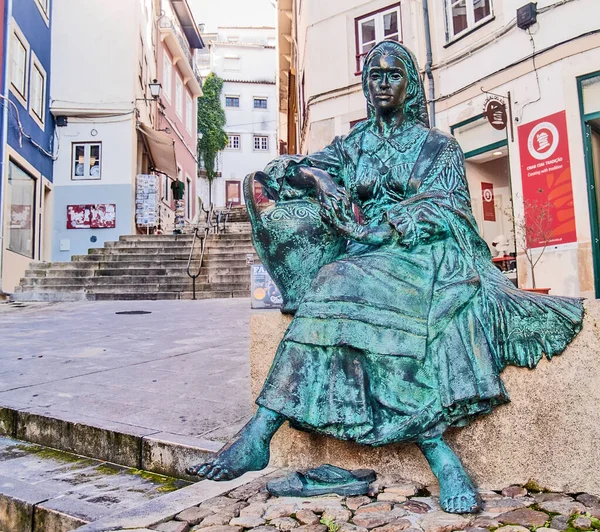 Traditional Portuguese woman sculpture in city