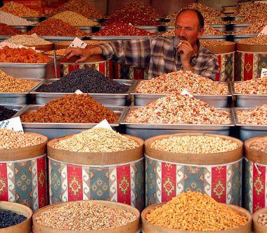 Nuts seller on the market clipart