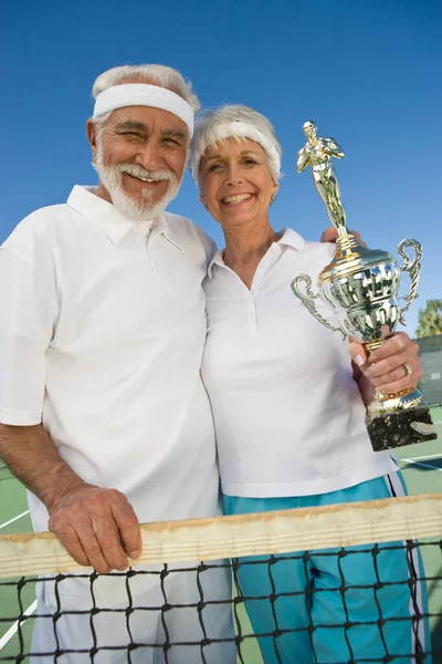 Portrait Happy Senior Couple Holding Trophy Tennis Net — Stock Photo, Image