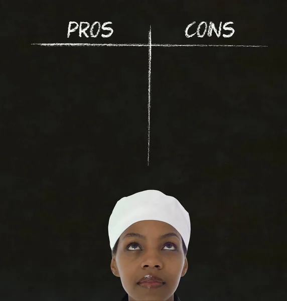 African American Woman Chef Thinking Chalk Pros Cons Blackboard Background — Stock Photo, Image