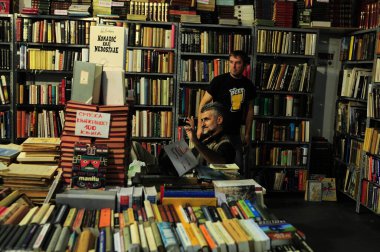 SERBIA, BELGRADE - OCTOBER 27, 2012: People choosing books at the International Belgrade Book Fair      