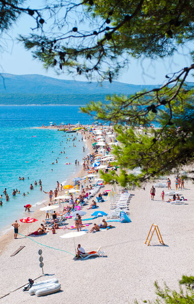 crystal clear water and pebble-bottom beach