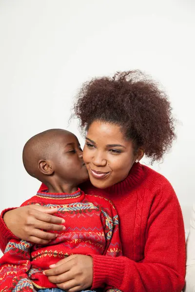 African American Boy Kissing His Mother — стокове фото