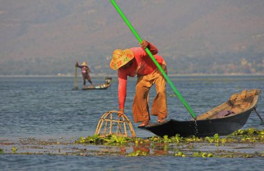 Men fishing on Inle Lake clipart