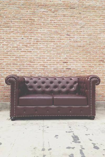 antique sofa by the wall