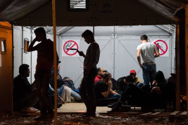 Macedonia, Gevgelija: Refugees spend the night at a camp in Gevgelija, Macedonia on September 25, 2015 clipart