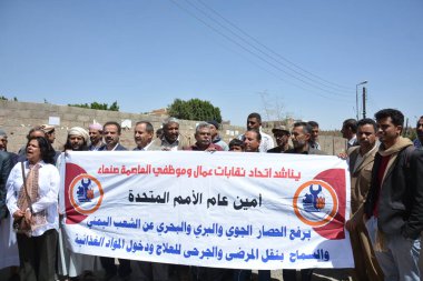 YEMEN, Sanaa: A small crowd of protesters gather outside a United Nations building in the Yemeni capital of Sanaa on October 1, 2015, calling for an end to the bombings in Yemen by the Saudi-led coalition.