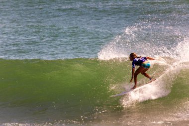 Professional female surfer compete on the Burleigh Pro 2013