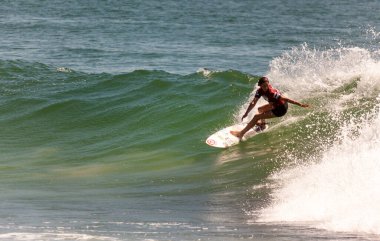 Professional female surfer compete on the Burleigh Pro 2013
