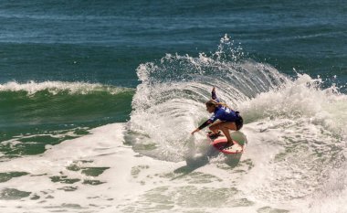 Professional female surfer compete on the Burleigh Pro 2013