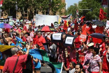 AUSTRALIA, Sydney: Tens of thousands of Sydney protesters call for a focus on the cost of climate change to Pacific Islands on November 29, 2015, just ahead of the COP21 conference on climate change
