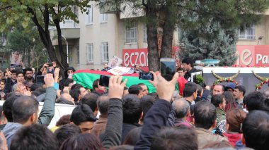 TURKEY, Diyarbakir : People carry the coffin of killed Kurdish Lawyer Tahir Elci during his funeral the day after his assassination in Diyarbakir on November 29, 2015.