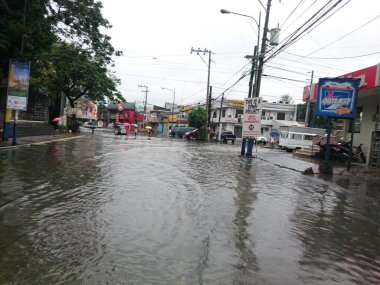 PHILIPPINES, Mandaluyong: Heavy rains hit the Boni avenue in Mandaluyong City, Metro Manila, in Philippines, on December 15, 2015, after the passing of Melor typhoon.