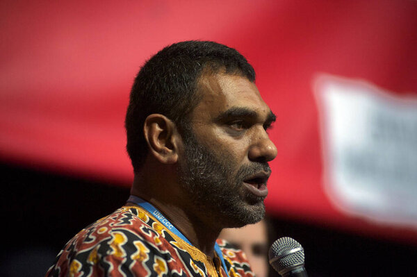 FRANCE, Paris: Executive Director of Greenpeace International Kumi Naidoo delivers a speech during a 'Climate Action Zone' conference held by the Coalition Climat 21, during the World Climate Change Conference 2015 (COP21)