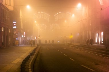 BOSNIA AND HERZEGOVINA, Sarajevo: People walk around Sarajevo, as heavy pollution covers the city on December 24, 2015.