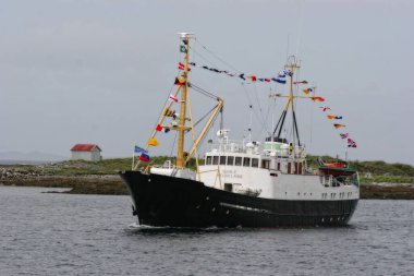 Veteran boat floating in sea