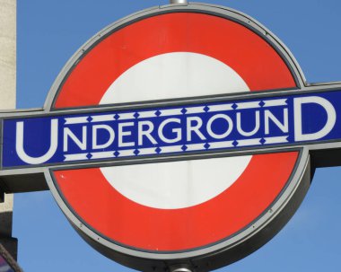 Underground sign over blue sky 