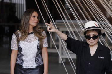 MEXICO, Mexico City: Japanese musician and artist Yoko Ono, widow of John Lennon, waves in front of a work titled 'Morning Beams/River Bed,' at a press event to mark the opening of her exhibition 'Land of Hope' 