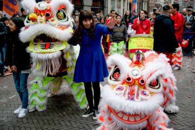 NETHERLANDS, The Hague: A dragon float parades through The Hague on February 13, 2016, for Chinese New Year celebrations. clipart