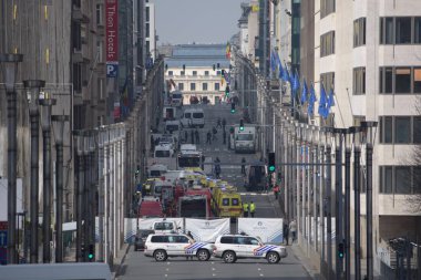 BELGIUM, Brussels : Police and emergency vehicles are pictured near Maelbeek metro station in Brussels, which has been evacuated after an explosion on March 22, 2016. 