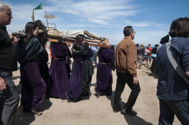 SPAIN, Valencia: Catholics march on their way to hold a beachside prayer for the dead in Valencia, Spain on Good Friday, March 25, 2016. The ceremony comes at the end of the Holy Week, just days before Easter Sunday.