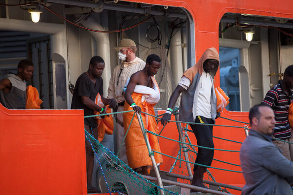 ITALY, Palermo: Migrants disembark from the Siem Pilot on April 13, 2016 in Palermo, Italy.The vessel has been a major transporter of migrants fleeing the Middle East and Africa to Europe. 