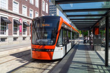 Modern train moving by railway station