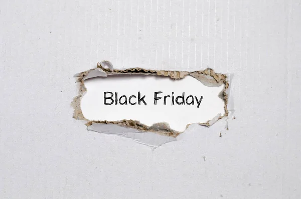 Words Black Friday Appearing Torn Paper — Stock Photo, Image