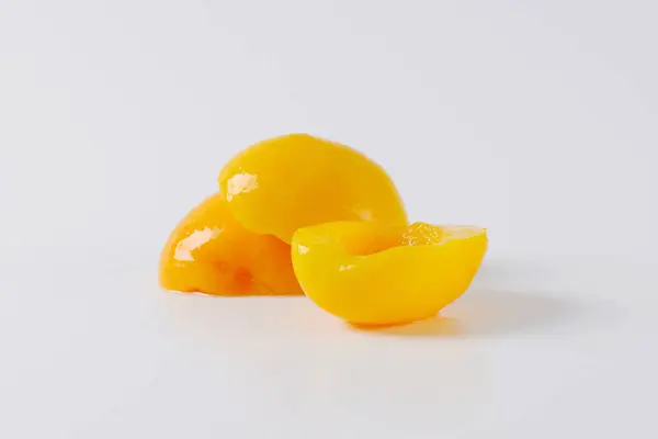 Closeup Canned Peaches White Background — Stock Photo, Image