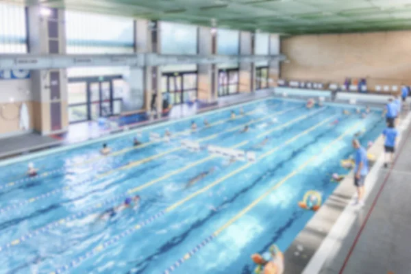 Defocused background with aerial view of a swimming pool indoor