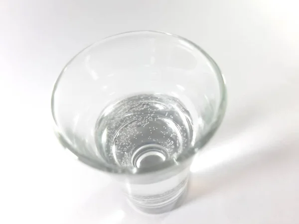 Drink in a transparent glass. Liquid pure water in a glass.