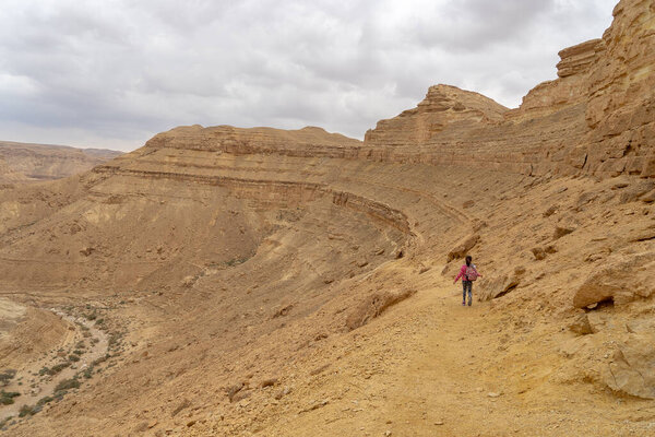 Child in hiking trek of Israeli desert 