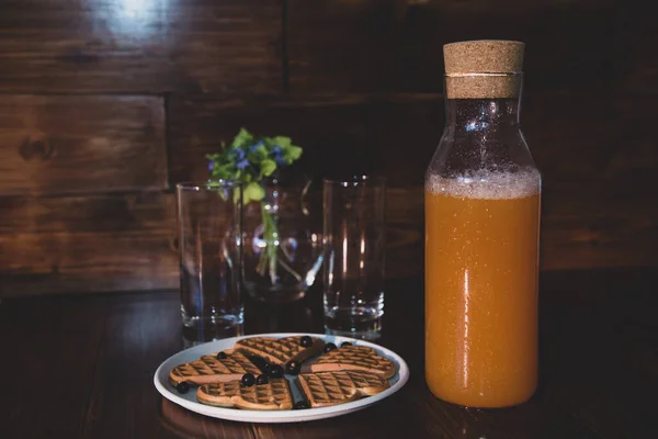 stock image breakfast for two. freshly squeezed juice and wafers