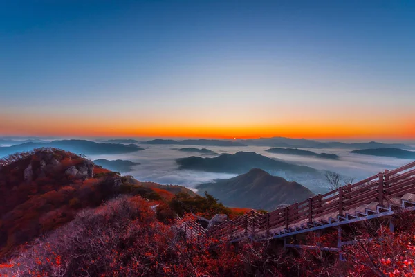 Morning mist in autumn on the peak of Cheonmasan mountain in Seoul, South Korea