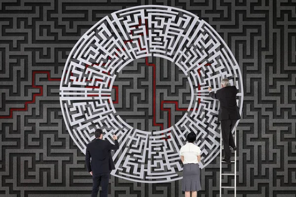 Business people drawing a maze