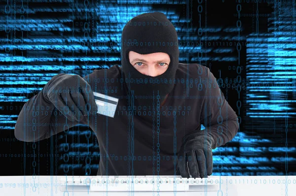 Hacker Holding Credit Card — Stock Photo, Image