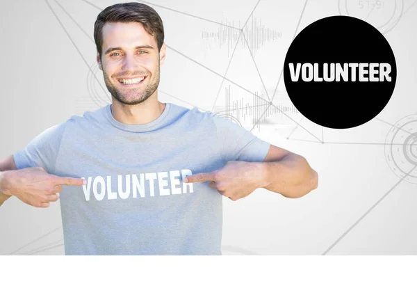 数字合成志愿者指向他的衬衫 — 图库照片